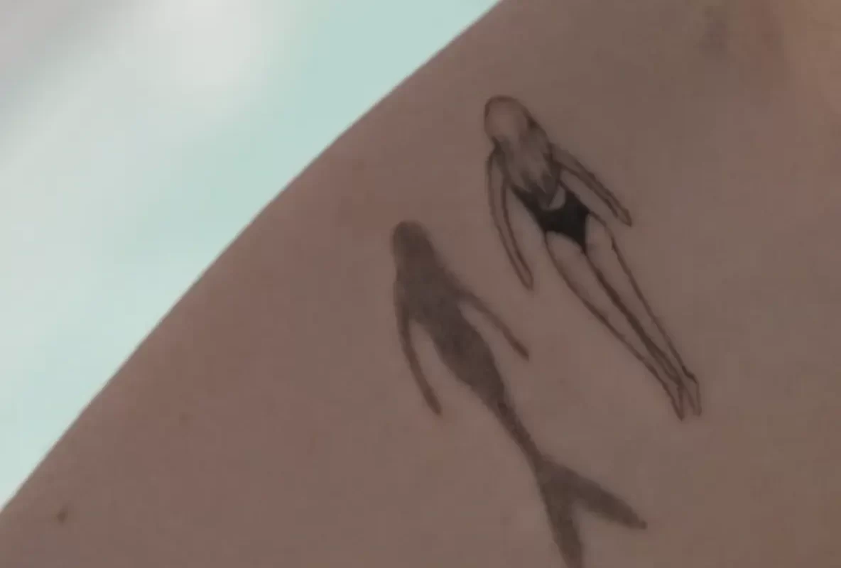 fine line tattoo aged